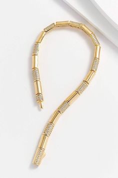 Hand-crafted with 14k gold plating over sterling silver, the smooth tube-style links alternate with clear diamonette-covered links for a delicate, yet confident style. Perfectly balanced on the wrist, this sophisticated bracelet pairs well with classic and modern styles. 14k gold plating, 925 sterling silver, diamonettes 6 3/4 L x 1/8" W Smooth tube-link style Environmentally-safe materials Free of lead, nickel, and cadmium Made in Turkey Ships from the U.S.A. Why we love this product? Just beau Gold Bracelet With Diamond Accents For Everyday Luxury, Modern Gold Diamond Bracelet With Rectangular Links, Gold Chain Bracelet With Diamond Accents For Everyday Luxury, Gold Diamond Bracelet With Rectangular Links For Everyday Luxury, Gold Tennis Bracelet With Rectangular Diamond Links, Gold Diamond Tennis Bracelet With Rectangular Links, Everyday Luxury Gold Diamond Bracelet, Modern Gold Tennis Bracelet With Rectangular Links, Modern Gold Cubic Zirconia Chain Bracelet