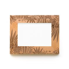 a wooden frame with an image of leaves on the front and bottom, against a white background