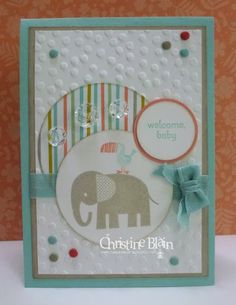 a card with an elephant on it and a ribbon around the bottom of its corner