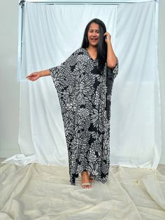 Indulge in the beauty of our classic kaftan with hand silk-screen printed fabric. This kaftan dress boasts unique patterns on high-quality rayon fabric. Its versatile design allows you to create many stylish looks, ensuring you always feel your best, whether you're at home or stepping out. Black Printed V-neck Kaftan, Oversized Printed Dresses With Kimono Sleeves, Traditional Black Printed Kaftan, Printed Dresses With Kimono Sleeves, Black Printed One Size Dress, Long Oversized Printed Kaftan, Oversized Long Printed Kaftan, Floral Print Patterned Tunic Kaftan, Floral Print Long Kaftan In Free Size