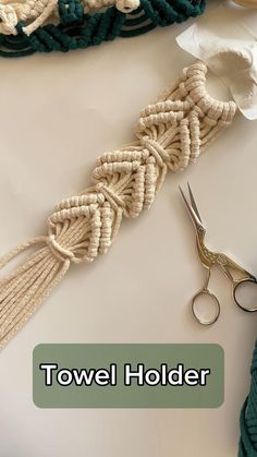 there is a pair of scissors and some rope on the table next to each other