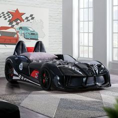 a black sports car bed in a room