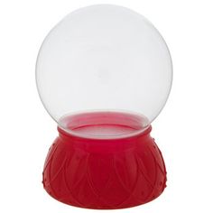 a snow globe sitting on top of a red stand