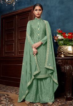 Pista green chinon palazzo suit 4601B  Desc:  Style : Pakistani Salwar Kameez Color : Pista Green Fabric : Chinon Work : Sequins Occasion : Ceremonial Wash Care : Dry clean Sleeve Style : Full Sleeve Long Sleeves : Done only in Custom Stitch Sleeves Lining : Done only in Custom Stitch Bust Size: 32 to 42 Inches. With Express Free Shipping and Custom Stitching, Buy Indian Wedding Party Wear Salwar Pista green chinon palazzo suit 4601B online in USA, UK and Canada from KollyBollyEthnics.com Luxury Pista Green Salwar Kameez For Navratri, Palazzo Dress, Vs Image, Pista Green, Pakistani Suit, Salwar Dress, Palazzo Suit, Pakistani Salwar Kameez, Wedding Saree Indian