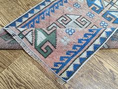 an old rug is laying on the floor with it's end cut off from