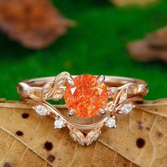 a close up of a ring on top of a leaf