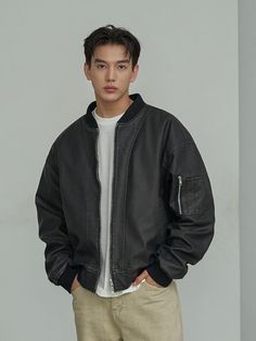 This basic bomber jacket features vintage mood washing texture and voluminous oversized silhouette so works well for versatile styling. It's finished with ribbed hem and two-way zipper to allow comfortable wear.  - Two-way zip-up fastening- Two front welt pockets- Utility pocket at sleeve- Ribbed edges- Internal pocket- Oversized fit- Please note lining is normal plain lining not quilted Men Black Jacket Outfit, Bomberjacket Streetstyle Man, Streetwear Leather Jacket With Ribbed Collar, Casual Leather Jacket With Padded Collar, Oversized Leather Jacket Outfits Men, Urban Leather Jacket With Ribbed Cuffs For Streetwear, Casual Leather Jacket With Ribbed Collar For Winter, Casual Winter Leather Jacket With Ribbed Collar, Casual Leather Jacket With Zipper For Urban Adventures