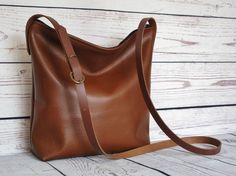 Toffee brown crossbody bag real leather slouchy by FidelioBags Distressed Brown Leather Shoulder Bag For Everyday Use, Classic Brown Crossbody Hobo Bag, Distressed Brown Soft Leather Shoulder Bag For Daily Use, Everyday Distressed Brown Leather-lined Shoulder Bag, Brown Suede-lined Crossbody Shoulder Bag, Brown Crossbody Bag, Brown Leather Shoulder Bag, Dark Tan, Tan Color