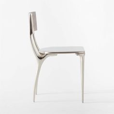 the back side of a modern chair with white upholstered seat and metal frame