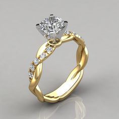 a yellow gold engagement ring with a twisted band and a round diamond in the center