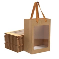 a brown paper bag sitting next to stacks of cardboard