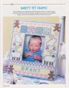 a baby's 1st frame is shown in the front cover of this cross stitch pattern