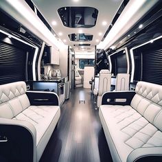 the interior of an rv with white leather seats and black trim on the wood flooring