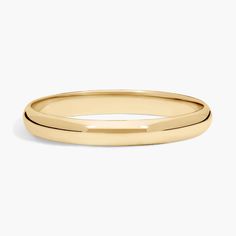 a plain gold wedding ring with two thin bands on the outside, and an open band at the top