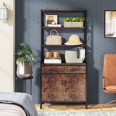 a bedroom with blue walls and a brown chair in front of a wooden bookcase