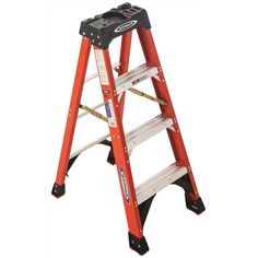 a red step ladder with tools on it