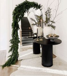 a black table topped with two plates filled with food next to a bannister