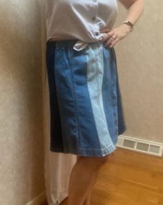 This is a one of a kind homemade denim blue jean leg panel skirt. I used the bottoms from 3 pairs of cotton jeans in different washes, light, medium and dark, reworking them and upcycling them making an eight section paneled skirt in 3 tones.  I washed the jeans in fragrance free soap before working with them. I cut eight panels from the legs, flaring them out slightly at the hem. I kept the jean hems intact for their style and character. The seams are done with a serger so they won't unravel. The waistband is elastic.  This is a medium to large fit skirt, depending on where you wear it on your waist. The unstretched length of the waist is about 16.5  inches across (33 doubled). The hip measurement is about 23" wide. (46) Length is about 20". If you'd like a similar but larger or smaller s Denim Patchwork Jeans, Repurposed Denim, Panel Skirt, Pink Seersucker, Fit Skirt, Boho Denim, Paneled Skirt, Denim Blue Jeans, Cotton Jeans