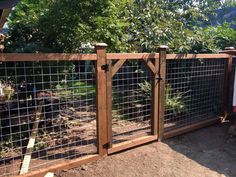 the fence is made of wood and wire