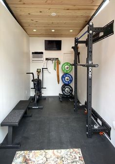 the inside of a home gym with equipment