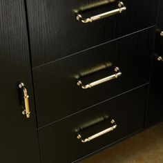 the drawers are black with gold handles