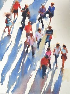 a group of people walking down a street next to each other