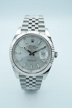 Own the iconic elegance of the Rolex 126334 Datejust 41 mm watch. With a stunning fluted bezel and sleek silver index dial, this timepiece is a complete set including a Jubilee bracelet. Be confident in your style and add this luxurious watch to your collection. Condition: Unworn Accessories: Original Box & Papers Warranty Dated: 2024 Details Reference Number: 126334 Model: Datejust 126334 | 126334-0004 Movement: Automatic Bezel Material: 18K White Gold Dial: Silver Dial Case Diameter: 41mm Brac Luxurious Watch, Rolex Usa, Datejust Ii, Hublot Watches, Rolex Watches For Men, New Rolex, Rolex Air King, Box Paper, Photo Pendant