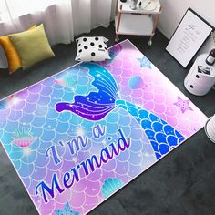 a mermaid themed area rug with the words i'm a mermaid in purple and blue