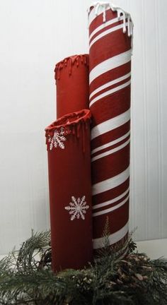 two red and white candy canes sitting next to each other on top of a wreath