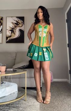 a woman in a green and gold corset is standing in a living room