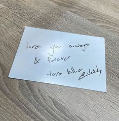 a piece of paper with the words love you always and forever written on it sitting on a wooden table