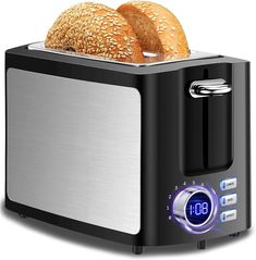 two loaves of bread sitting on top of a toaster