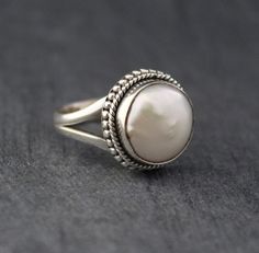 White Oval Pearl Ring, Elegant White Adjustable Moonstone Ring, Elegant Handmade Pearl Ring For Wedding, Classic Jewelry With Stone Setting For Wedding, White Sterling Silver Wedding Rings, Sterling Silver Wedding Ring With Stone Setting, Heirloom White Rings For Marriage, Heirloom White Ring For Marriage, Silver Sterling Silver Pearl Ring For Wedding