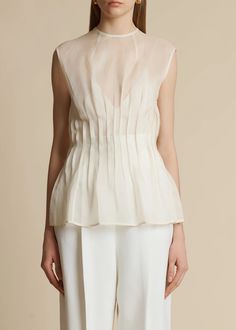 The Westin Top in Bone– KHAITE Elegant Sleeveless Organza Blouse, Elegant Sleeveless Sheer Blouse, Spring Silk Chiffon Fitted Blouse, Spring Fitted Silk Chiffon Blouse, Fitted Sleeveless Organza Blouse, Classic Sheer Evening Tops, Sleeveless Organza Tops For Spring, Elegant Silk Chiffon Summer Tops, Sheer Sleeveless Blouse