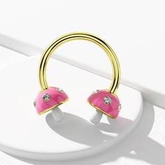 Description: Show off your love of mushroom fashions and bright colors whenever you wear this crazy adorable and dainty 16g horseshoe septum ring. It features a three-dimensional mushroom ends, with a baby pink mushroom umbrella embellished with micro CZ beads and a white mushroom stem. That's sure to put you in a sunny mood! Safe Material: High polished 316L stainless steel, which can be worn with ease and for a long time. This bar is internally threaded. Standard Size: The bar thickness is 16 Pink Mushroom Jewelry For Gifts, Mushroom Stem, Mushroom Umbrella, Horseshoe Septum, White Mushroom, Pink Mushroom, White Mushrooms, Septum Clicker, Tragus