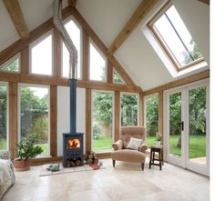 a living room filled with furniture and a fire place in the middle of it's walls