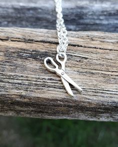 This cute, necklace has a scissors charm and would make a great gift for someone who loves to quilt or sew! The charm and chain are a silver color. The scissors measures 3/4 inch and you can choose the length of the necklace at checkout. This would make a great gift for a birthday, an anniversary, Christmas or any other occasion. All jewelry items come in a gift box. Cute Charm Necklaces For Gifts, Cute Jewelry With Lobster Clasp For Gifts, Handmade Cute Charm Necklaces For Mother's Day, Adjustable Necklace With Lobster Clasp For Birthday Gift, Handmade Silver Charm Necklace For Birthday Gift, Silver Novelty Necklace For Gift, Novelty Necklace With Lobster Clasp For Gift, Handmade Adjustable Charm Necklaces For Birthday, Handmade Adjustable Charm Necklace For Birthday