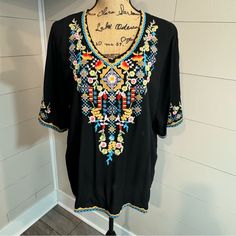 Women's Size Large - Nwt - Black Lightweight Flowy Top With Beautiful Colorful Embroidery On Front And Back And Around The Sleeves. Oversized With Short Sleeves. Measured Flat In Inches Not Stretched P2p: 21.5" Length: 28" Smoke And Odor Free! Fast Shipping! Keywords Only Boho Bohemian Embroidered Floral Casual Work Business Party Colorful Feminine Flattering Festival Versitile Summer Spring Top Blouse Tunic Shirt Black Bohemian Top With Embroidered Hem, Bohemian Black Tops With Embroidered Neckline, Black Embroidered Tunic Blouse, Black Floral Print Festival Blouse, Black Floral Print Blouse For Festival, Black Embroidered Top With Geometric Patterns For Festivals, Black Bohemian Blouse With Geometric Embroidery, Black Embroidered Top With Geometric Design For Festival, Black Embroidered Top For Festival