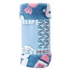 a blue and pink towel with an image of a white dog on it's side