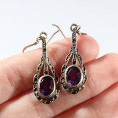 ~Length: 1&1/2 inch ~Amethyst size: 3/8 x 1/4 inch ~Marked 925 Ornate Purple Sterling Silver Earrings, Vintage Amethyst Purple Earrings, Vintage Amethyst Earrings Gift, Purple Vintage Jewelry, Antique Purple Sterling Silver Jewelry, Antique Sterling Silver Purple Jewelry, Purple Stamped 925 Earrings For Anniversary, Hoco Dress, Earrings Antique