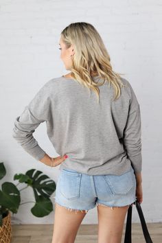 Introducing the Clarice Cozy Sweater, the perfect blend of style and comfort. With a round neck and seam detailing, this sweater is designed for a relaxed fit and features cozy knit fabric for those chilly days. Complete with ribbed hem and cuffs, side slits, and available in Heather Grey, Black, Oatmeal, & Ivory. Pair with jeans or shorts for a versatile look. Round neck Seam detailing on center front Long sleeves, Drop shoulder Cozy Knit Pullover, Relaxed Fit Ribbed hem and cuffs Side slits, H Ribbed V-neck Sweater For Winter Loungewear, Cozy Ribbed V-neck Long Sleeve Sweater, Long Sleeve V-neck Sweater For Layering, Cozy Soft Knit V-neck Sweater For Layering, Cozy Relaxed Fit V-neck Sweater For Layering, Cozy Winter Sweater For Casual Gatherings, Comfy Cozy Fit Gray Sweater, Everyday Gray Sweatshirt For Fall, Cozy Sweater For Casual Winter Gatherings