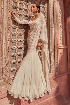 Buy Ivory Silk Embroidery Shubh Ganga Utsav Pre-draped Lehenga Saree With Blouse For Women by Nidhika Shekhar Online at Aza Fashions. Draped Lehenga, Drape Lehenga, Lehenga Sari, Fish Cut, Sari Lehenga, Georgette Saree With Blouse, Full Sleeve Blouse, Padded Blouse, Ready To Wear Saree