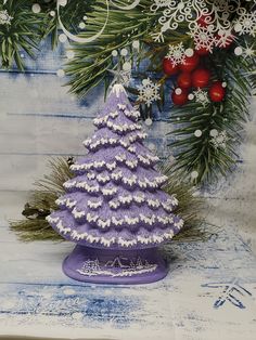 a knitted christmas tree sitting on top of a table