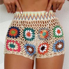 a close up of a person wearing shorts with crochet