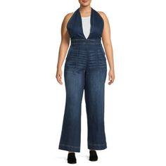 Be bold in Dollhouse Juniors Plus Size Plunging Neckline Denim Jumpsuit. Crafted in a lightweight denim with a touch of stretch, the figure-flattering look is body-skimming through the hip and relaxed through the thigh, ending in a flared leg to balance the plunging V-neck bodice. Crisscross back straps are adjustable for a perfect fit. Bonus: Lots of pockets to hold essentials! Dress it up with a pair of heeled sandals or booties. Size: 20W.  Color: Blue.  Gender: female.  Age Group: kids. Plus Dresses, Denim Jumpsuit, Blue Gender, Be Bold, Dress Romper, Plunging Neckline, Heeled Sandals, Gender Female, Doll House