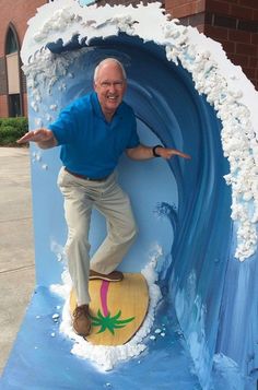 an older man on a surfboard in a fake wave