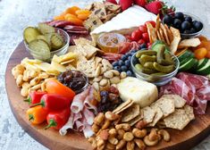 a wooden platter filled with different types of food