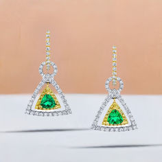 These earrings are gorgeous and stunning! Two trillion cut tsavorite garnets are set with round brilliant-cut diamonds and bright yellow sapphires. The garnets are a beautiful, brilliant grass-green color. The yellow sapphires and diamonds compliment and contrast with the green garnets and add even more sparkle. They are made of 18k white and yellow gold by our Master Jewelers in Los Angeles. Luxury Green Diamond Earrings With Accents, Green Diamond Earrings Fine Jewelry, Green Diamond Earrings In Fine Jewelry Style, Formal Tsavorite Earrings Fine Jewelry, Green Pave Setting Fine Earrings, Green Earrings With Pave Setting As A Gift, Green Diamond Earrings With Gemstone Accents, Green Brilliant Cut Drop Earrings, Gold Triangle