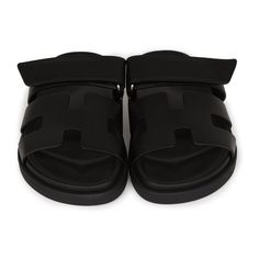 This pair of Cypre sandals are in Black calfskin and feature the iconic H and a velcro crossover strap. Origin: ItalyCondition: New and never wornAccompanied by: Hermes box, dustbags, ribbonSize: 34.5 EU Luxury Black Slides With Buckle Closure, Designer Leather Slide Sandals, Luxury Black Calf Leather Slides, Luxury Black Mules With Buckle Closure, Luxury Double Strap Sandals With Tang Buckle, Luxury Double Strap Calf Leather Sandals, Luxury Black Sandals With Tang Buckle, Black Slip-on Sandals With Tang Buckle, Designer Double Strap Leather Sandals