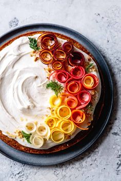 a cake with white frosting and colorful toppings